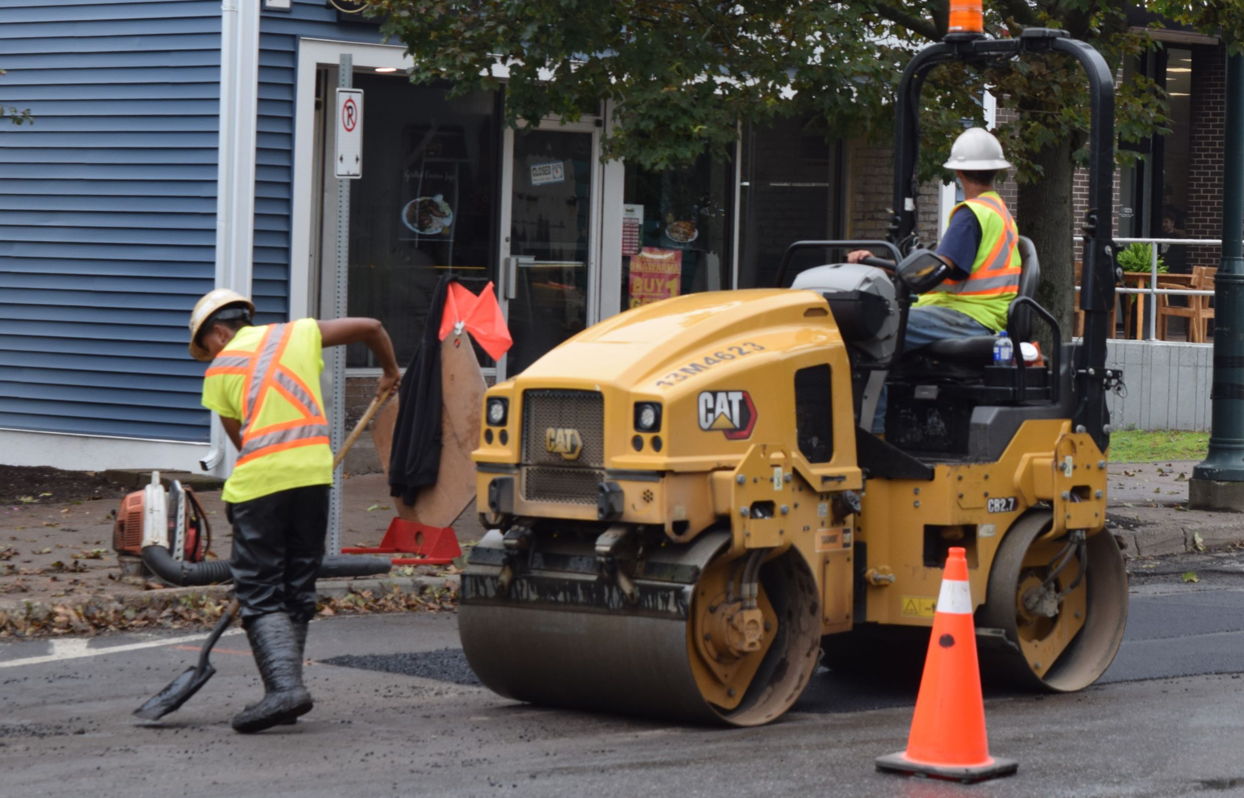 Roller finishing an asphalt patch on Main Street in Antigonish